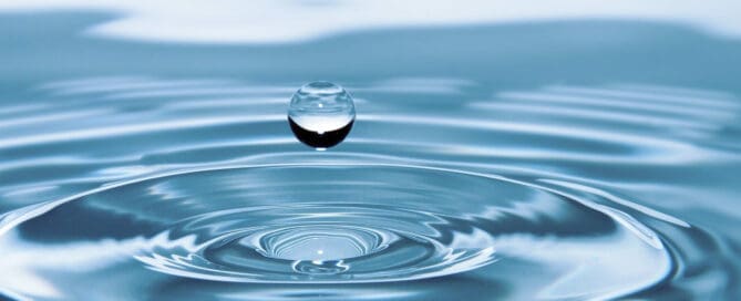 water droplet into filled water container
