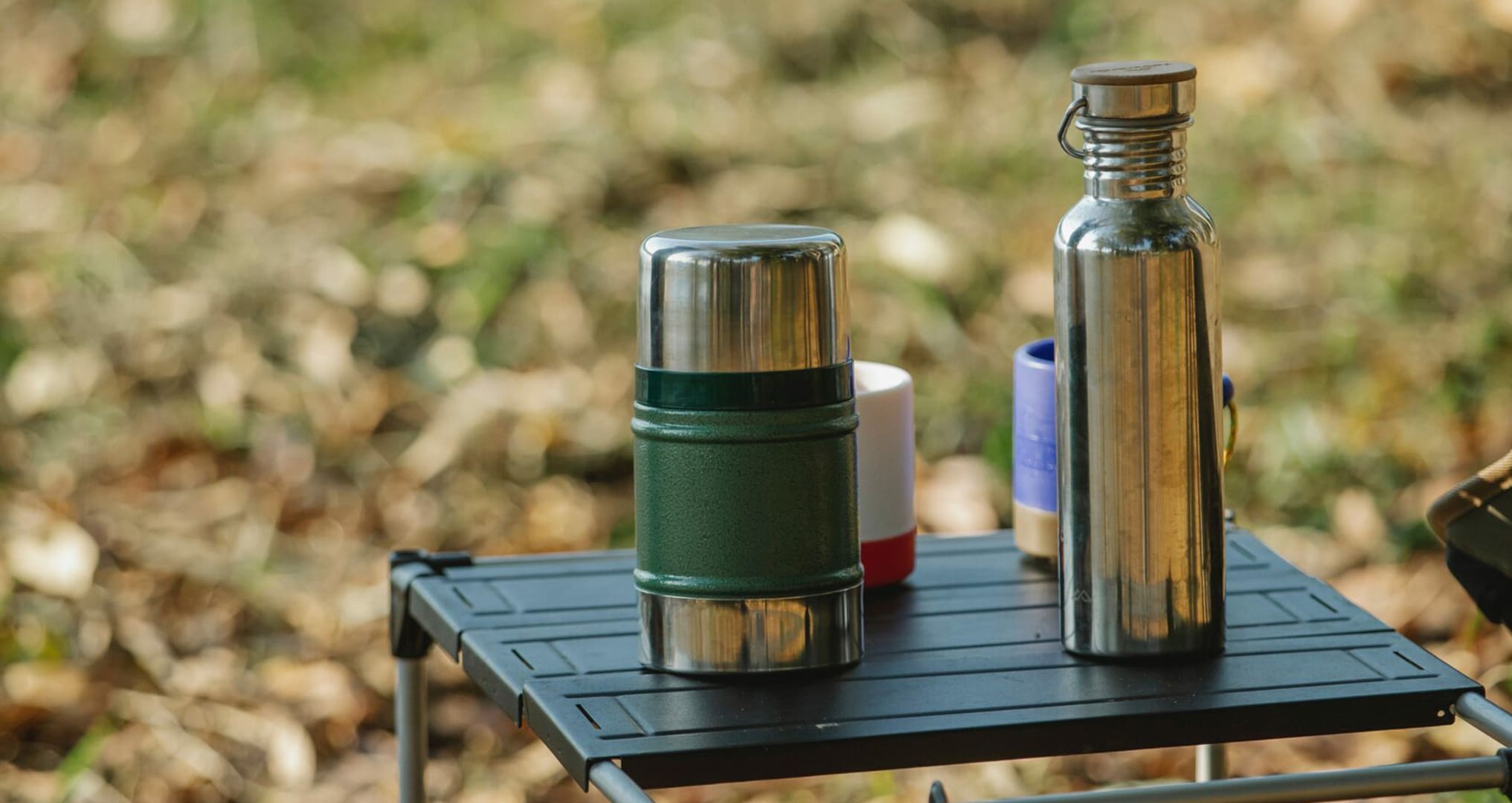 reusable water bottles on camping table reusable water bottles on camping table