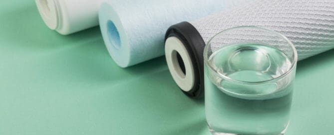 Filters on table next to water glass