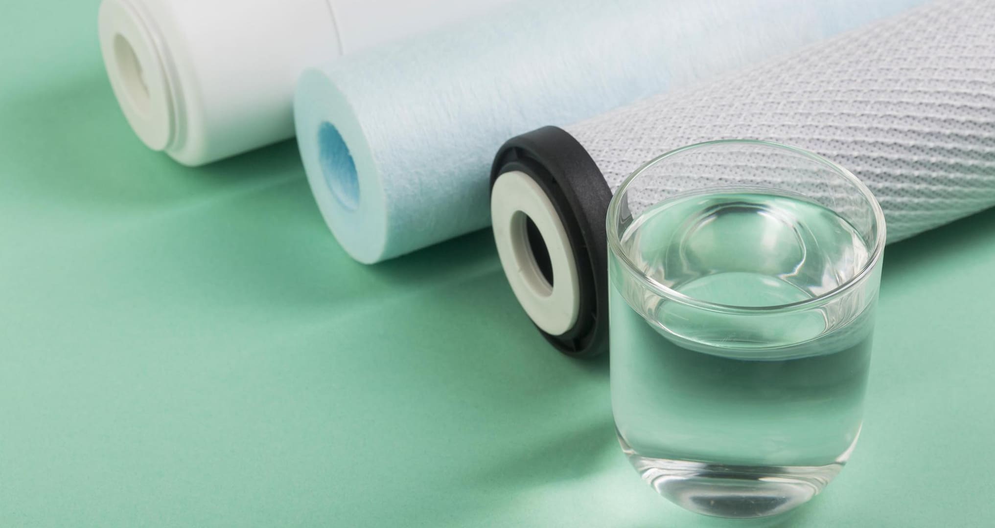 Filters on table next to water glass
