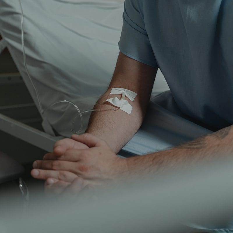patient with iv in arm patient with iv in arm