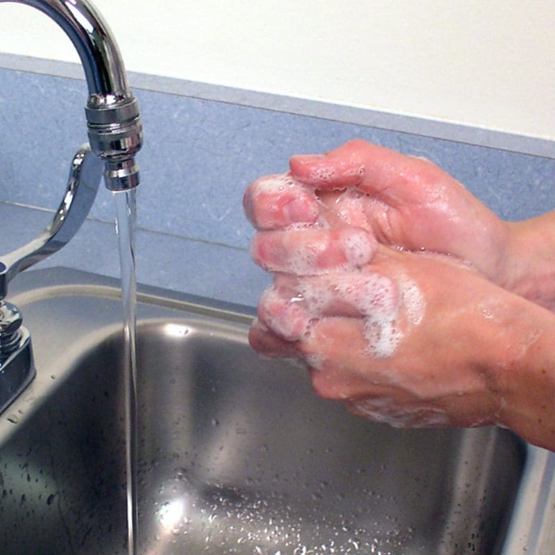 someone washing their hands someone washing their hands