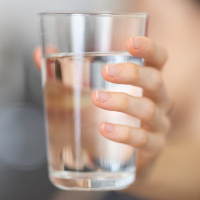 woman holding glass of water Women with glass of clean water