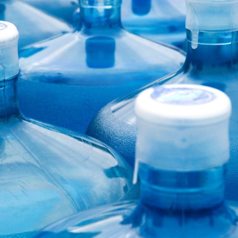 water jugs sitting on floor water jugs