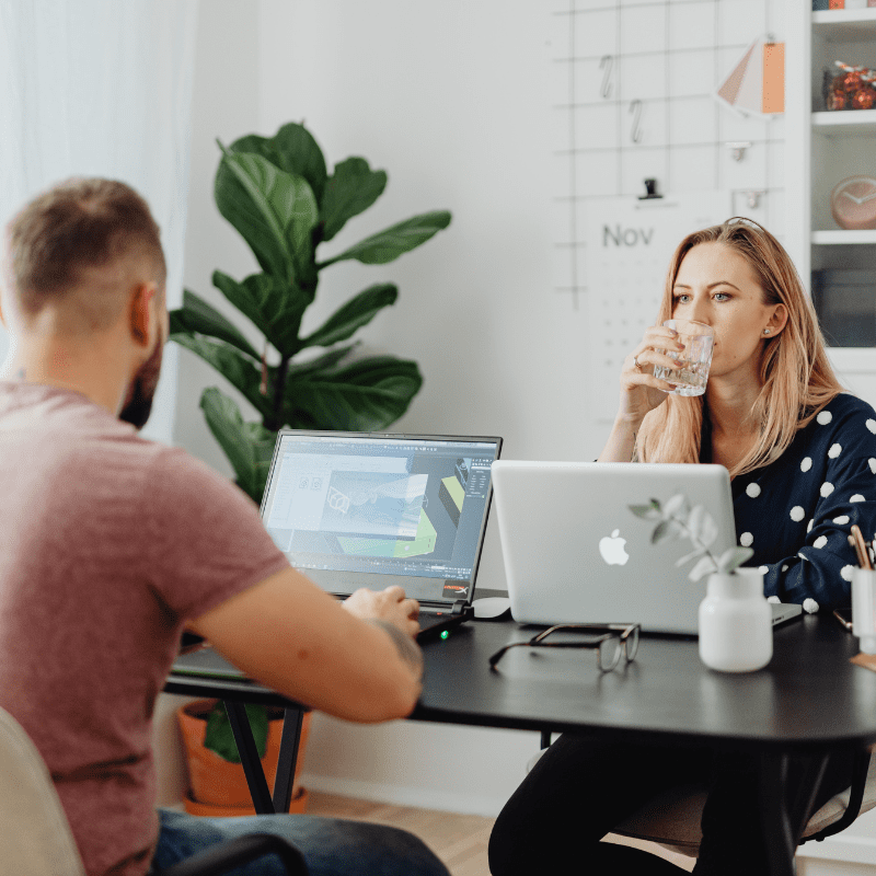 A man and a woman in an office. A man and a woman in an office.