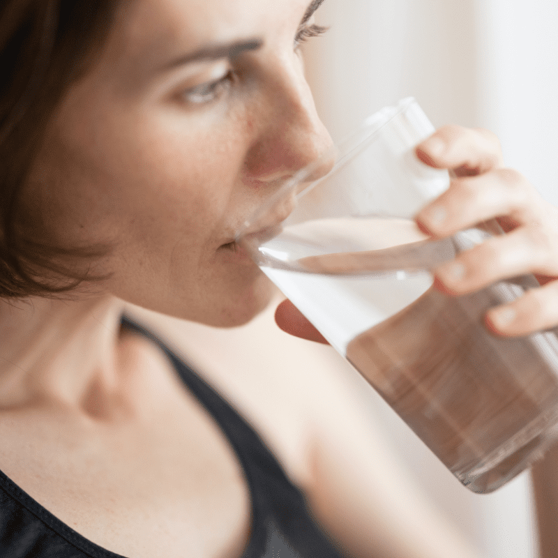 Woman drinking contaminated water