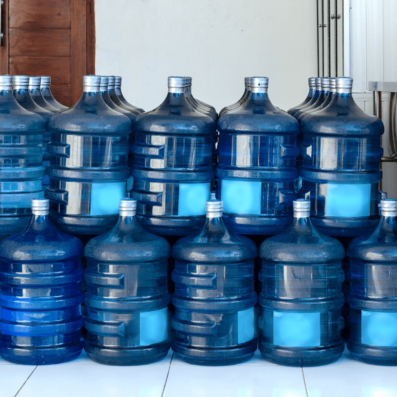 row of 5-gallon water jugs row of 5-gallon water jugs