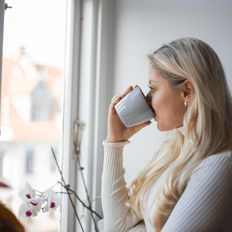 woman sips tea at work woman sips tea at work