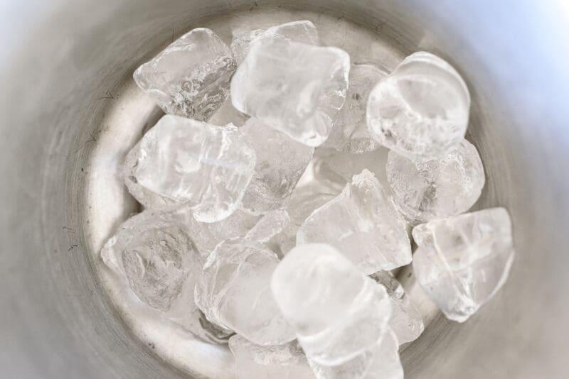 Cubed ice inside an ice bucket. Cubed Ice in Bucket