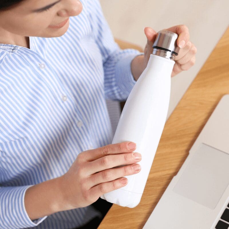 woman with reusable water bottle woman with reusable water bottle